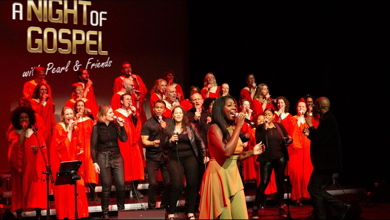 Ilaisa singing with red-robed gospel choir during “A Night of Gospel” live concert project